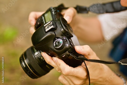 camera
camera in human hands
fotik
human hands
object in hand
photographer
photographer taking pictures with a camera photo