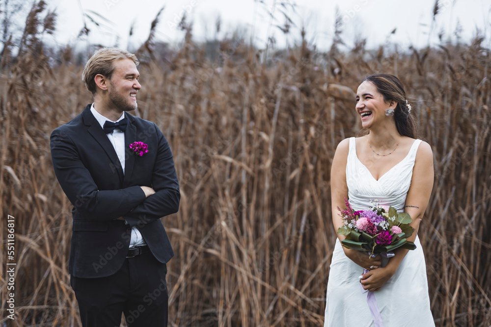 Newly married couple having fun, laughing at each other. High quality photo Newly married couple having fun, laughing at each other. High quality photo