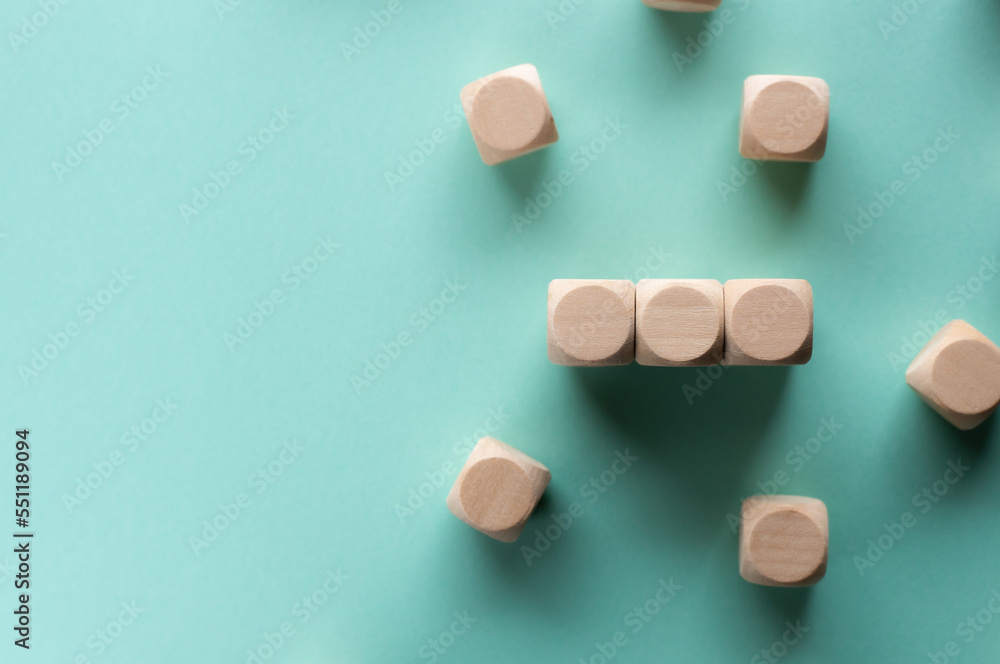 Three wood cubes are placed on a black background. Material for composing text. Three wood cubes are placed on a black background. Material for composing text.