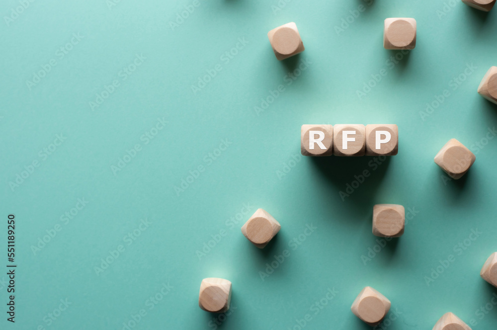 There is wood cubes with the word RFP. It's an abbreviation for Request for Proposal. There is wood cubes with the word RFP. It's an abbreviation for Request for Proposal.