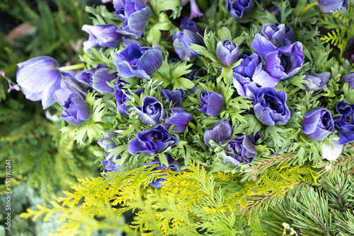 Ranunculus blue in a bouquet for sale on display in a flower shop