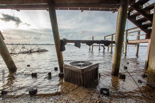 Wallpaper Mural Half buried ac unit under building destroyed by hurricane IAN.  Torontodigital.ca