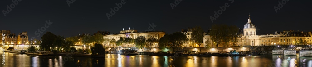 Paris evening riverside panorama overlooking Pont des Arts and Pont Neuf bridges