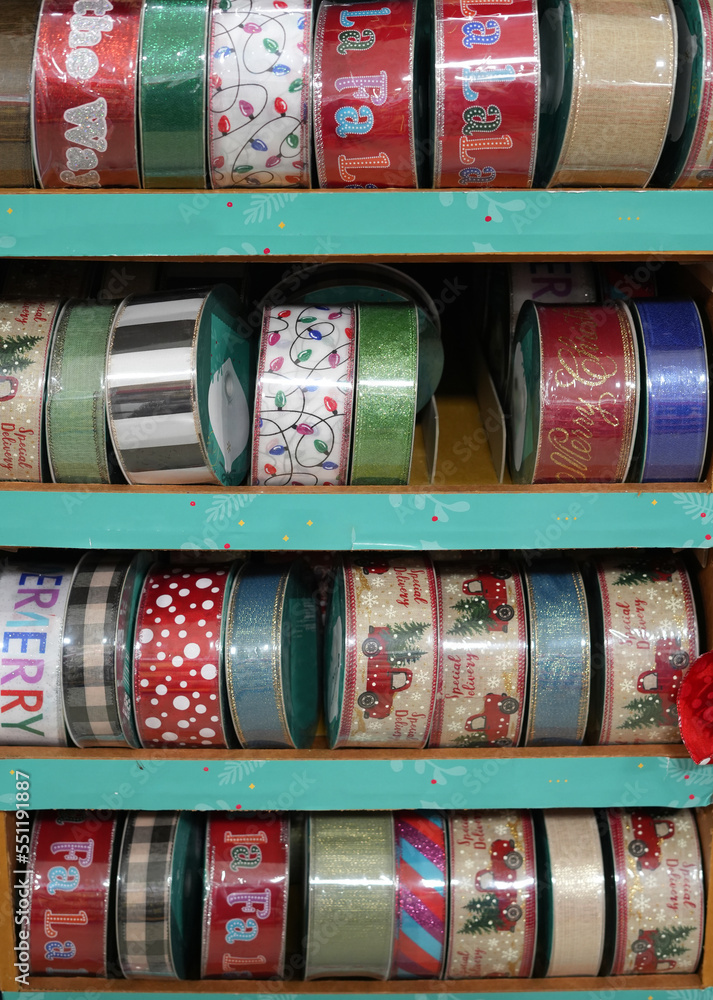Christmas ribbon stripe roll in package on the shelf for sale