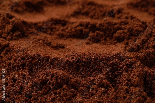 Dry ground coffee as background, closeup view © New Africa