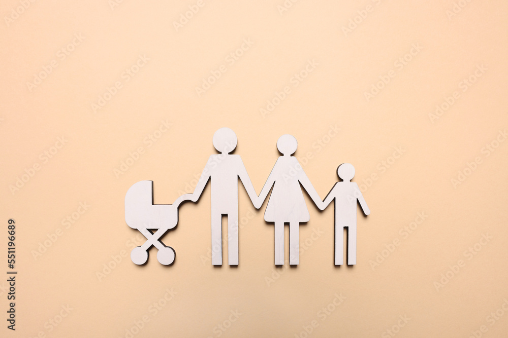 Figures of family on beige background, top view. Insurance concept Figures of family on beige background, top view. Insurance concept