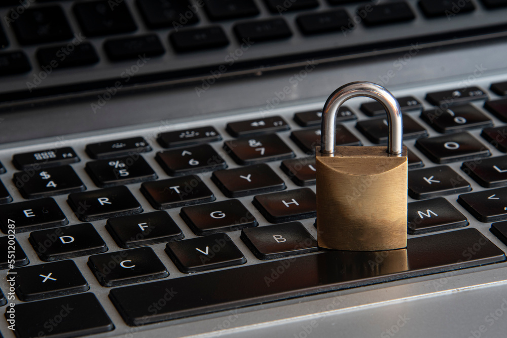 internet and computer security represented by a closed padlock over a black keyboard internet and computer security represented by a closed padlock over a black keyboard