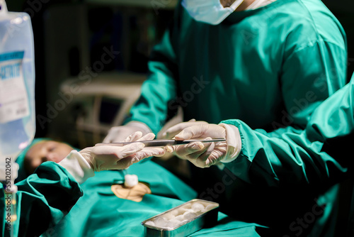 A team of professional doctors perform surgery in a hospital, a group of surgeons working in the operating theater.