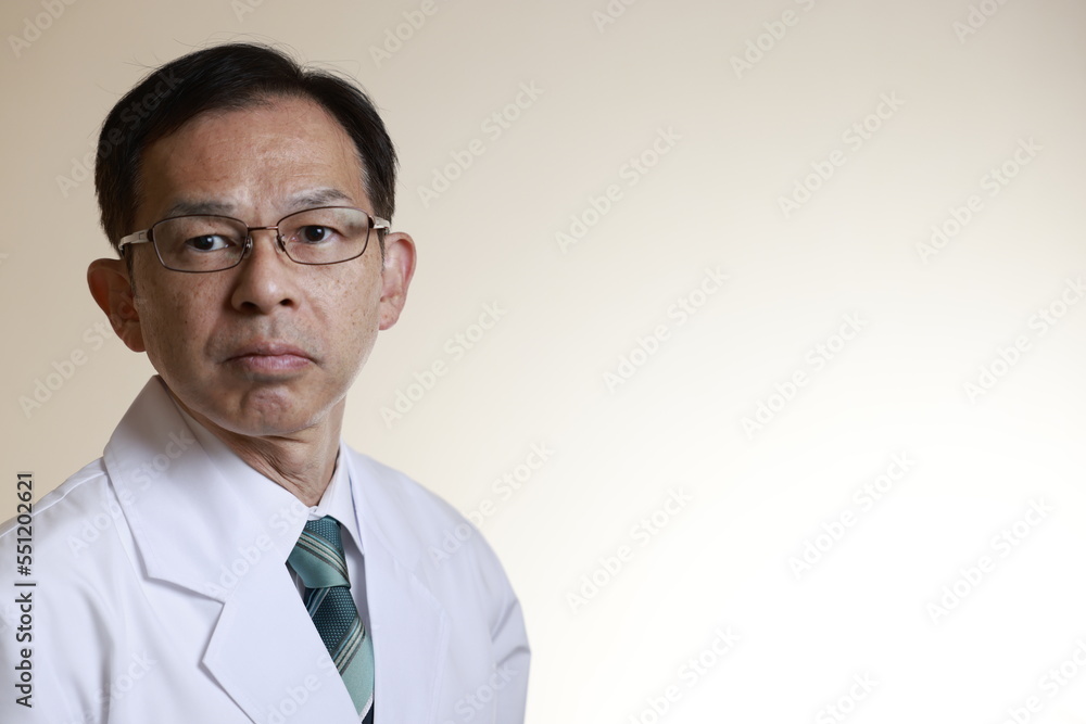 Middle-aged Asian doctor in a white coat on white background. Concept image of regenerative medicine, vaccine development and advanced therapy.
