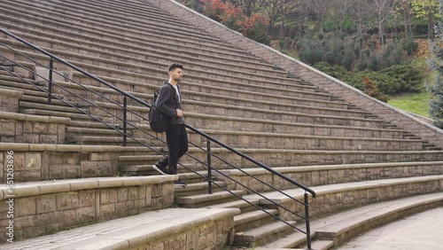 Wallpaper Mural Lonely young man walking alone outdoors.
A young person walking alone has no friends. Loneliness.
 Torontodigital.ca