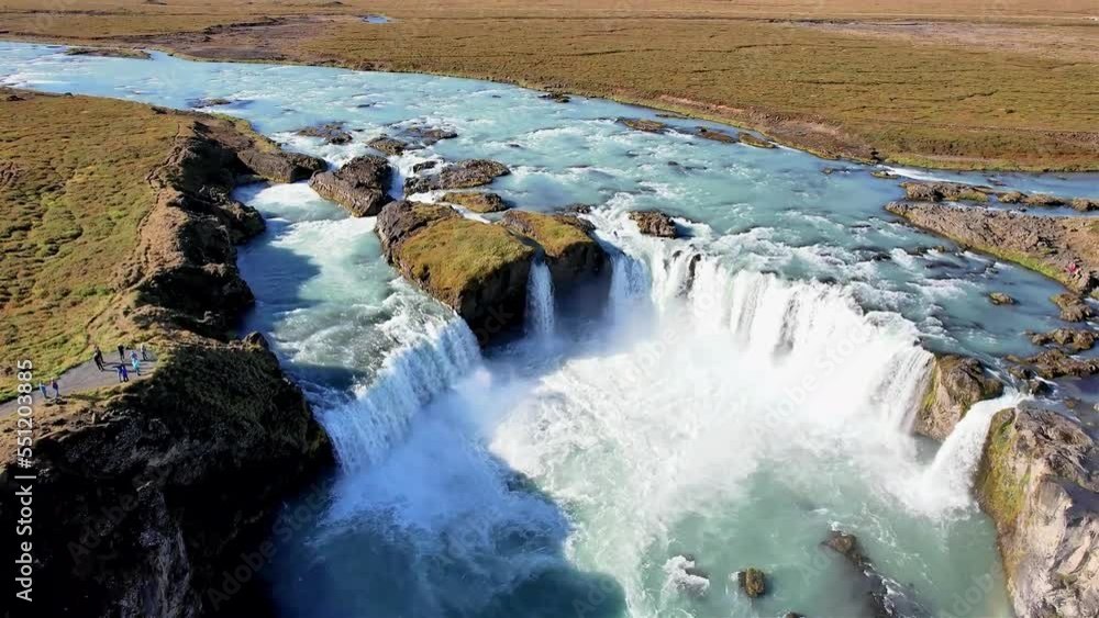 Godafoss Waterfall in Iceland is nicknamed the Waterfall of the Gods. Aerial view with drone. Godafoss Waterfall in Iceland is nicknamed the Waterfall of the Gods. Aerial view with drone.