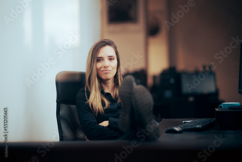 Confident Bossy Manager with her Feet on the Desk. Unmotivated office employee with quiet quitting attitude
