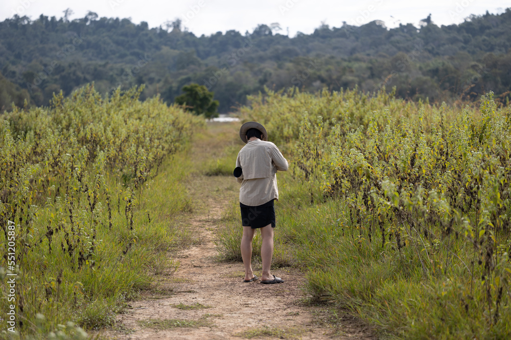 Photographer is taking a picture of scenic landscape. Photographer is taking a picture of scenic landscape.