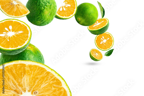 Floating Calamansi or Green Orange Fruits isolated on white background photo