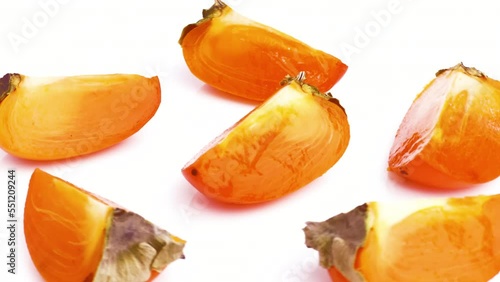sliced persimmon isolated on white background