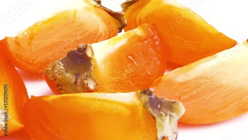 sliced persimmon isolated on white background