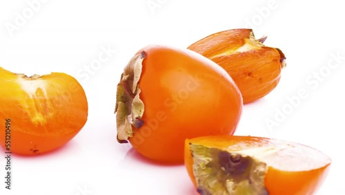 sliced persimmon isolated on white background