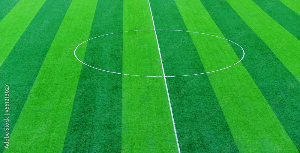 Obraz premium Green grass soccer field for background