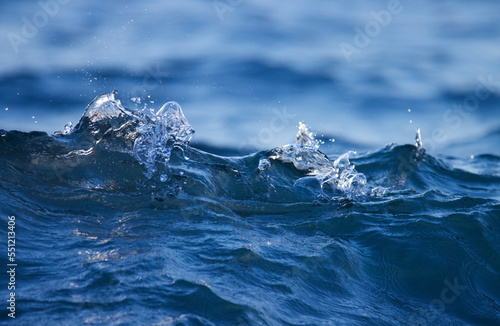 Dark blue ocean wave closeup. Sea wave on beach.