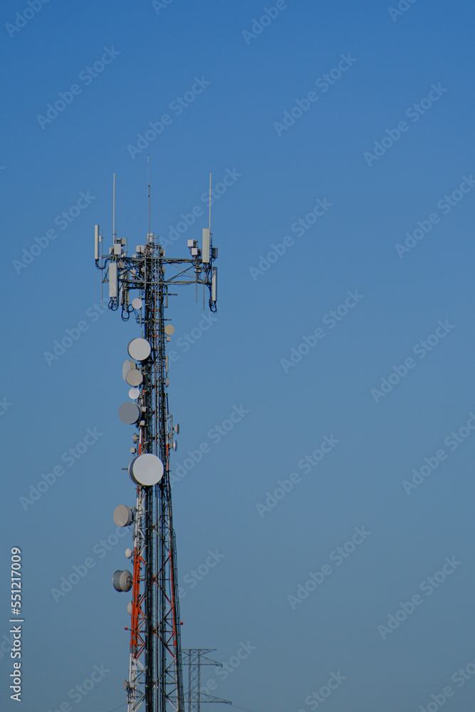 RF Communication transmission towers under cloudy sky