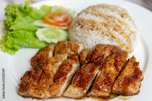 Grilled chicken with teriyaki sauce and rice.