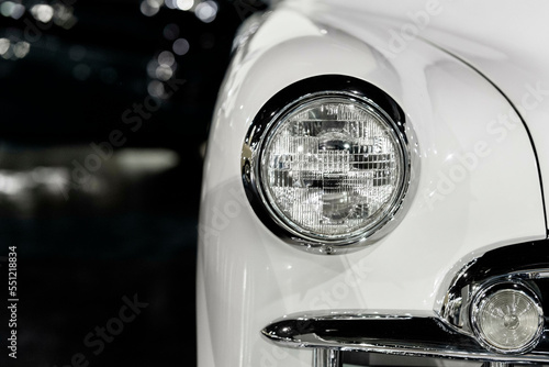 Classic Antique Car Headlight with copy space and dark background.