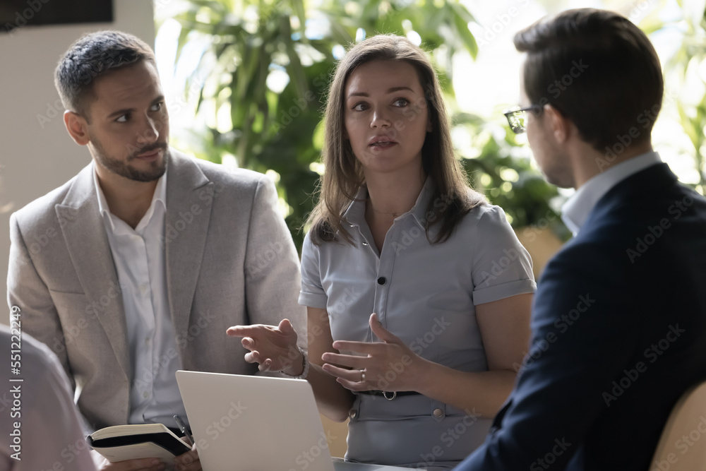 Φωτογραφία Group of businesspeople gather in office for morning briefing, corporate meeting