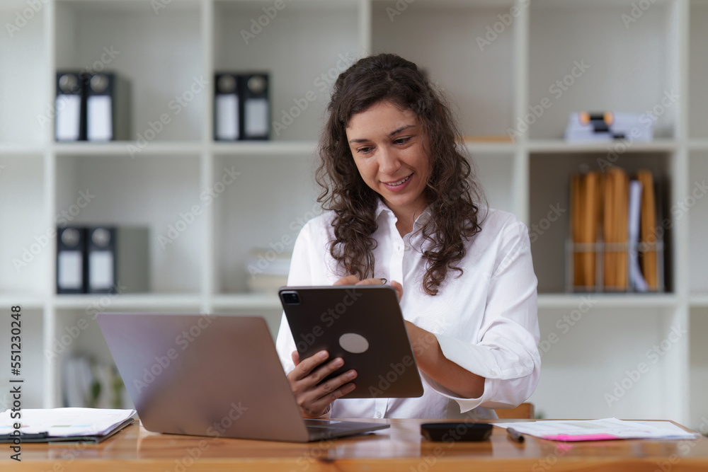 Business woman working at home office and analyze financial report document. Accounting and Finance concept Business woman working at home office and analyze financial report document. Accounting and Finance concept