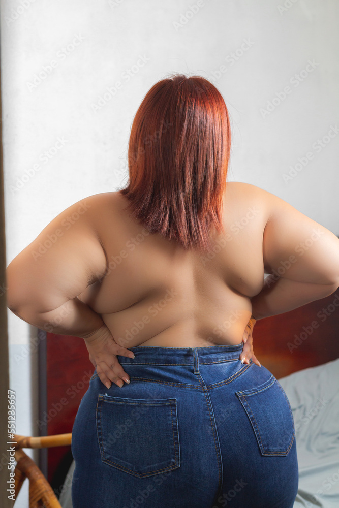 Foto de latin plus size woman naked from behind, concept of self esteem and  acceptance do Stock