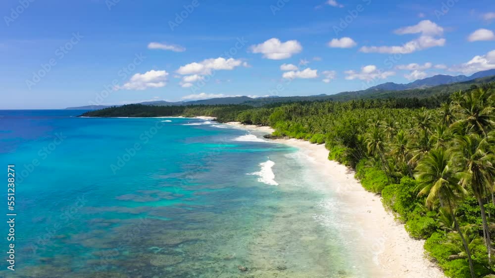 Tropical landscape with a beautiful beach in the blue water. Philippines, Mindanao. Summer and travel vacation concept. Tropical landscape with a beautiful beach in the blue water. Philippines, Mindanao. Summer and travel vacation concept.