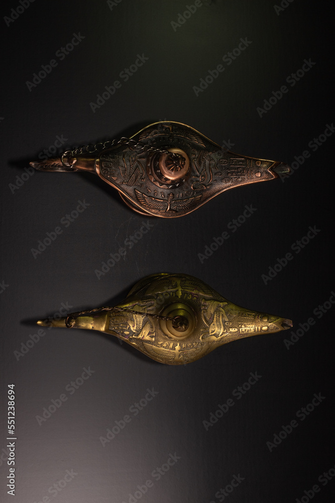 Fototapeta premium Aladdin's magic lamp isolated on black background