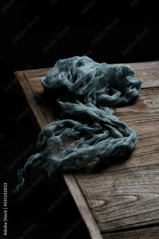 pile of cloth in the corner of the rustic table