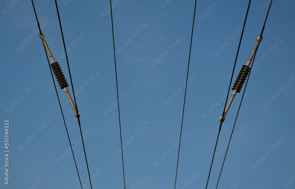 A spacer used to separate high voltage wires, held by a common corridor