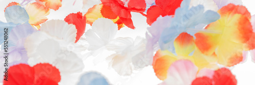 Colorful panoramic background. Colorful plastic hawaii flowers