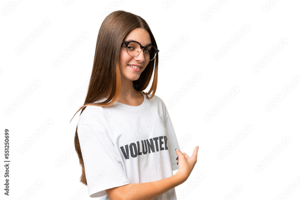 Teenager volunteer caucasian girl over isolated background pointing back Teenager volunteer caucasian girl over isolated background pointing back