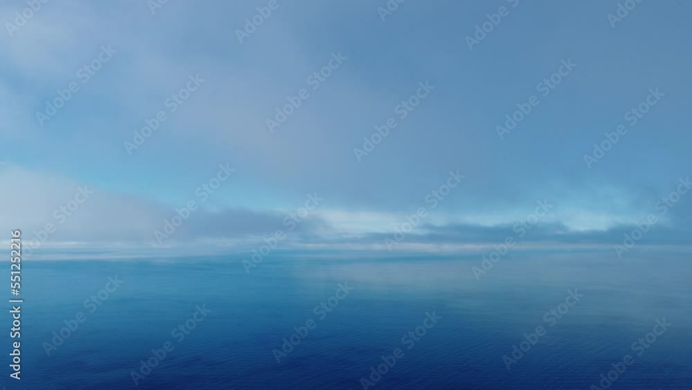 Fog over sea. Abstract aerial nature summer ocean sunset sea and sky background. Small waves on clear water surface with bokeh lights from sunrise. Holiday, vacation and recreational concept