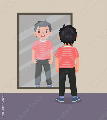 happy little boy standing in front of mirror looking his reflection with new clothes