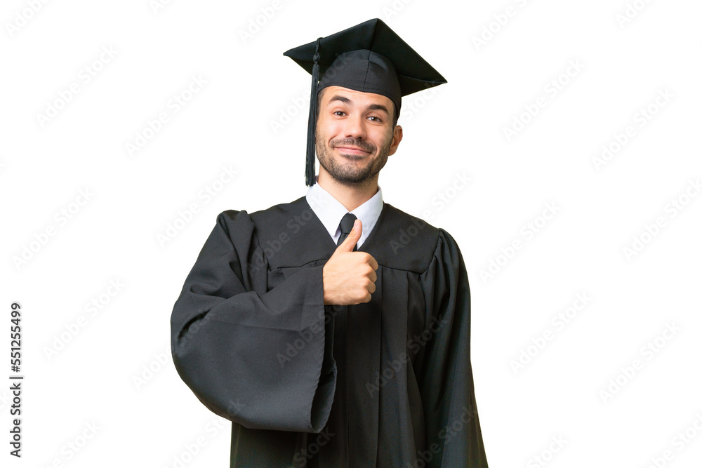 Young university graduate man over isolated background giving a thumbs up gesture Young university graduate man over isolated background giving a thumbs up gesture