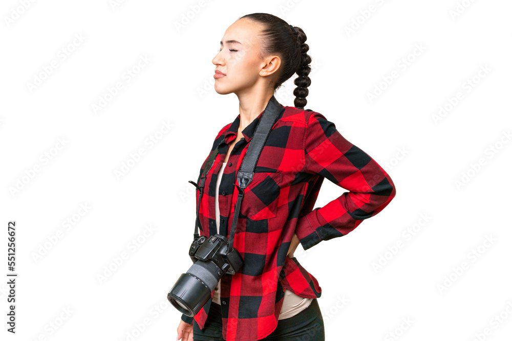 Young photographer Arab woman over isolated background suffering from backache for having made an effort Young photographer Arab woman over isolated background suffering from backache for having made an effort