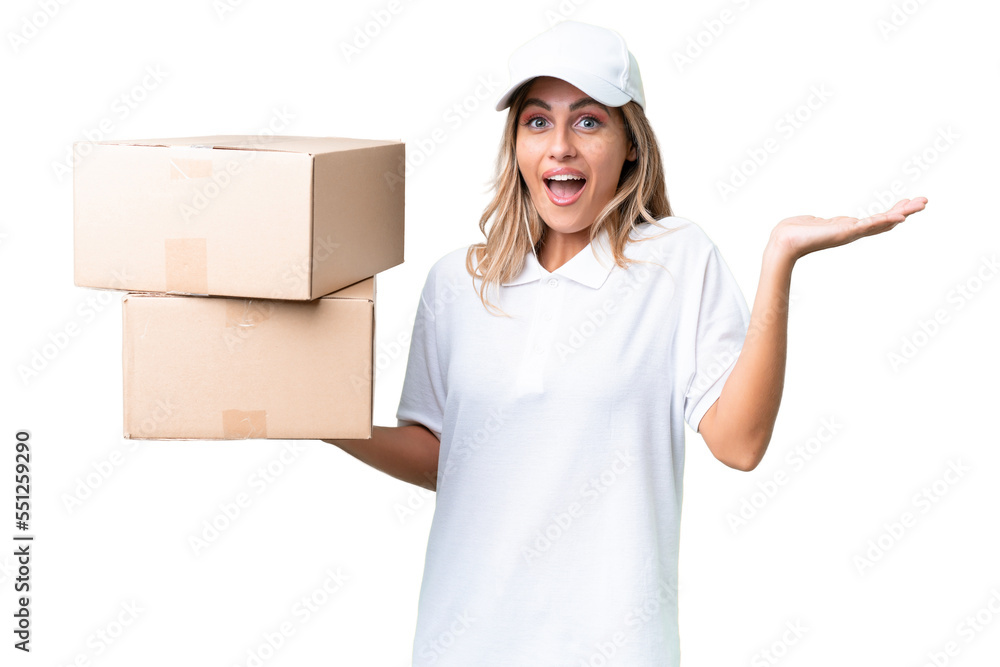 Delivery Uruguayan woman over isolated background with shocked facial expression Delivery Uruguayan woman over isolated background with shocked facial expression
