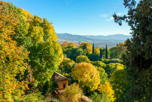 Walking in green gardens of Alhambra in Granada, Spain on November 26, 2022