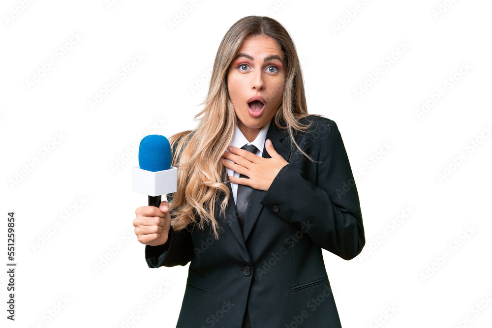 Young pretty Uruguayan tv presenter over isolated background surprised and shocked while looking right Young pretty Uruguayan tv presenter over isolated background surprised and shocked while looking right