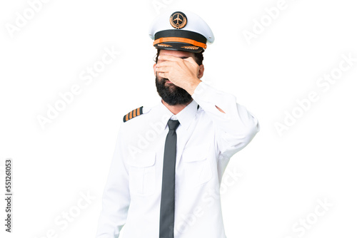 Airplane caucasian pilot man over isolated chroma key background covering eyes by hands. Do not want to see something © luismolinero