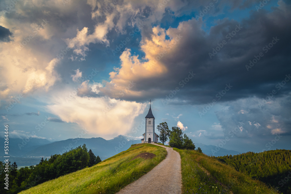 Stunning rural scenery with Saint Primoz church at sunset, Slovenia Stunning rural scenery with Saint Primoz church at sunset, Slovenia