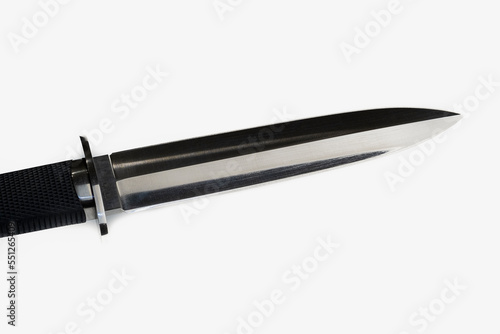 Hunting knife isolated on white background. souvenir collectible silver dagger with a scabbard, with metal engraving, on a white background. Sharp knife blade, stainless steel knife The blade of a ste