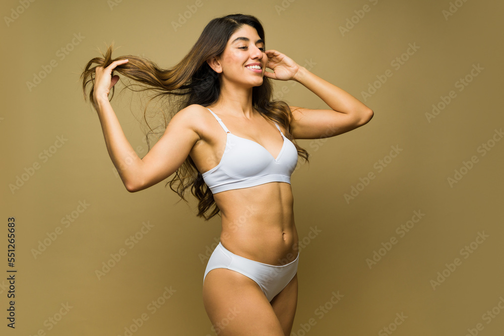 Obraz premium Happy relaxed woman in underwear having fun