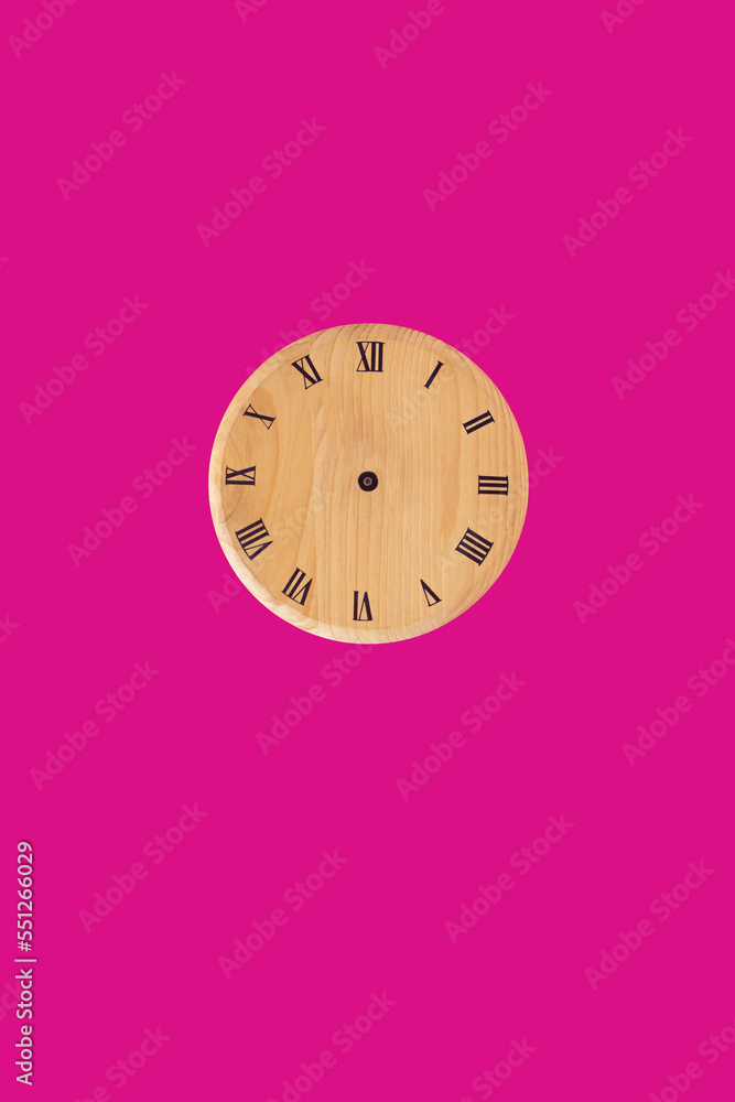 Wooden wall clock icon isolated on pink background. Interior design. The concept of time. Copy space. Top view. Wooden wall clock icon isolated on pink background. Interior design. The concept of time. Copy space. Top view.