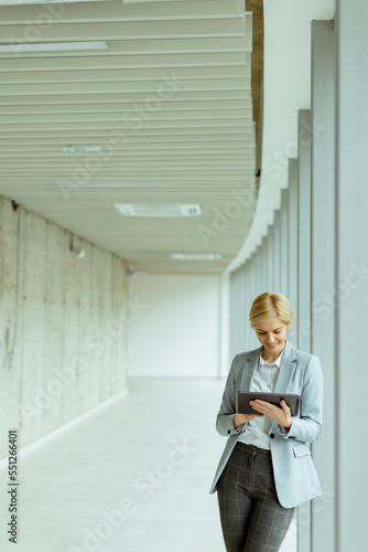 Businesswoman using digital...