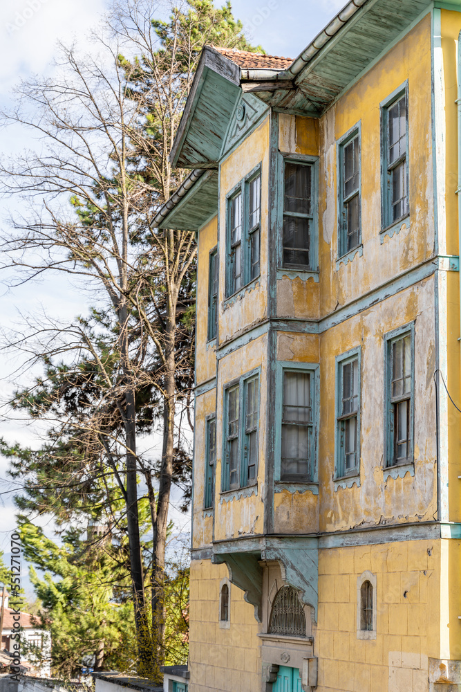 Fototapeta premium Traditional Ottoman house in Safranbolu. Safranbolu UNESCO World Heritage Site. Old wooden mansion. turkish architecture. Wooden ottoman mansion. green and blue wooden houses windows