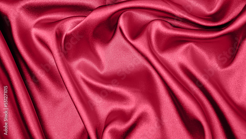 Viva Meganta toned red magenta fabric atlas. Close up pink silk satin texture for sewing. Abstract background wallpaper. Twisted folds cloth. Trendy color of the year 2023. Fashion color pattern

 photo